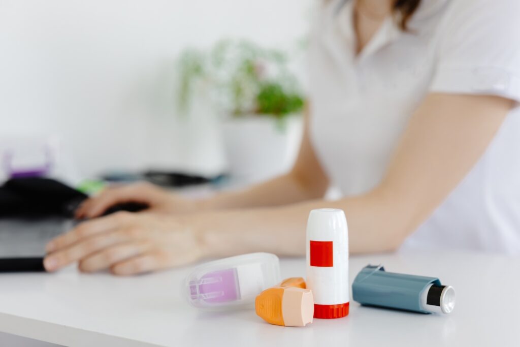 A doctor talking to a patient about different types of inhalers and how to use them to treat Asthma and COPD.