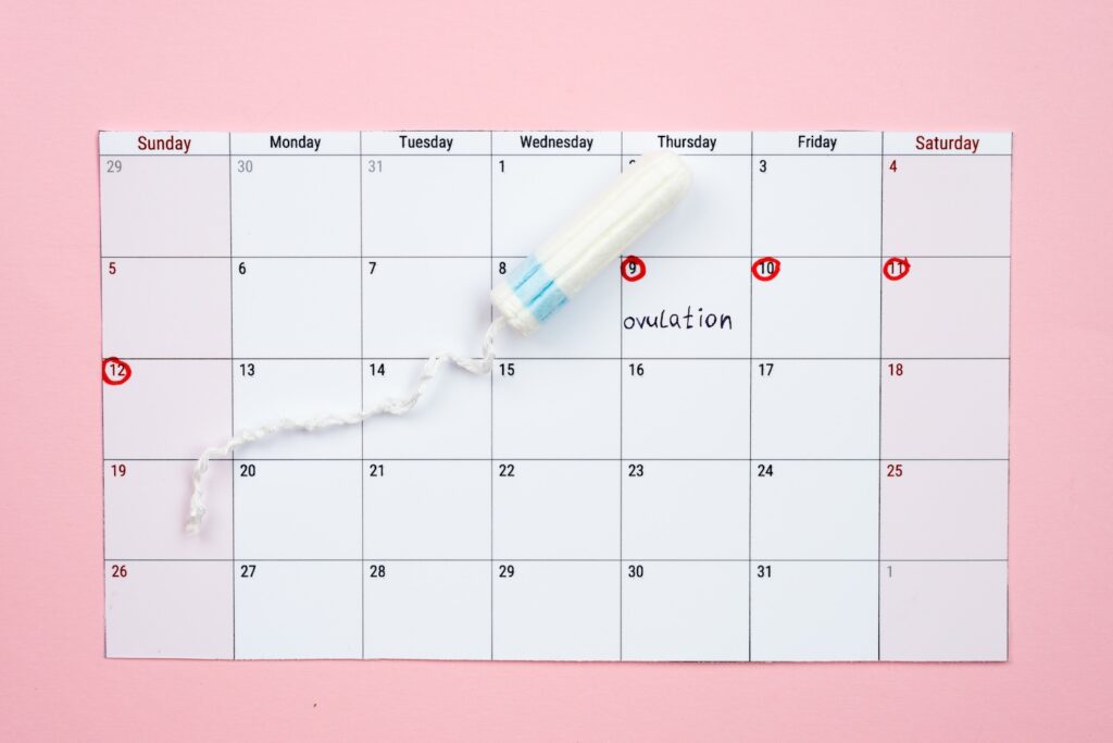 A tampon on a calendar showing 'does mounjaro affect your period'